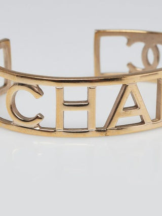 Chanel Goldtone Brushed Metal Logo Cuff Bracelet