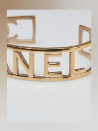 Chanel Goldtone Brushed Metal Logo Cuff Bracelet