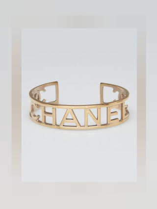 Chanel Goldtone Brushed Metal Logo Cuff Bracelet