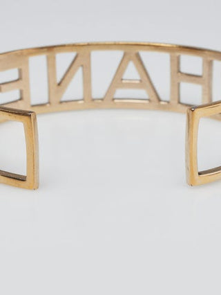 Chanel Goldtone Brushed Metal Logo Cuff Bracelet