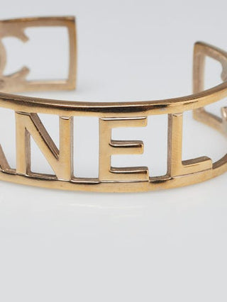 Chanel Goldtone Brushed Metal Logo Cuff Bracelet