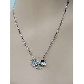 Chanel Silver-tone Interlocking CC Crystal Bow Necklace