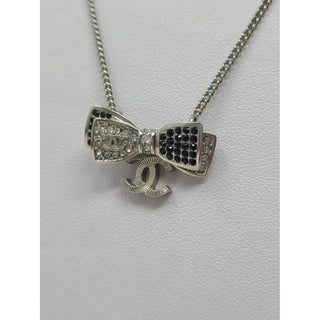 Chanel Silver-tone Interlocking CC Crystal Bow Necklace