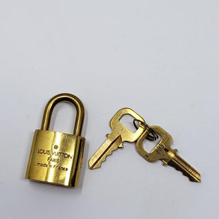 Louis Vuitton goldtone lock and keys set #303