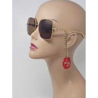 Eye catching Gucci gold-tone chain GG logo charm sunglasses