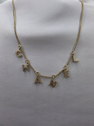 Chanel Gold-tone C-H-A-N-E-L logo charm Collar Necklace