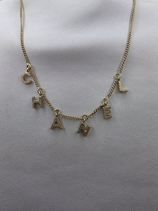 Chanel Gold-tone C-H-A-N-E-L logo charm Collar Necklace