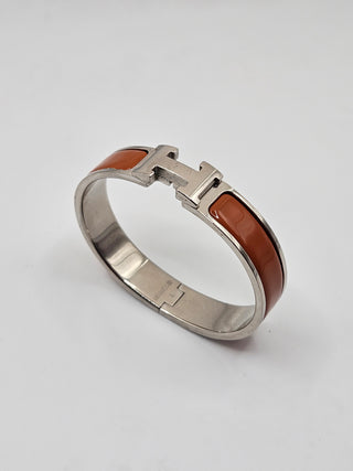 Hermès Orange Enamel Clic H Palladium plated Bangle Bracelet