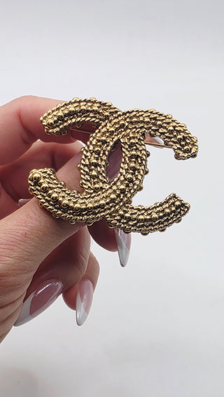 Chanel Gold-tone Resin Textured Interlocking CC Logo Brooch