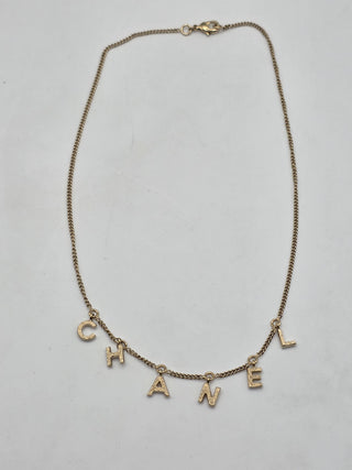 Chanel Gold-tone C-H-A-N-E-L logo charm Collar Necklace