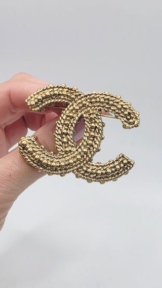 Chanel Gold-tone Resin Textured Interlocking CC Logo Brooch