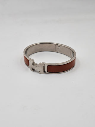 Hermès Orange Enamel Clic H Palladium plated Bangle Bracelet